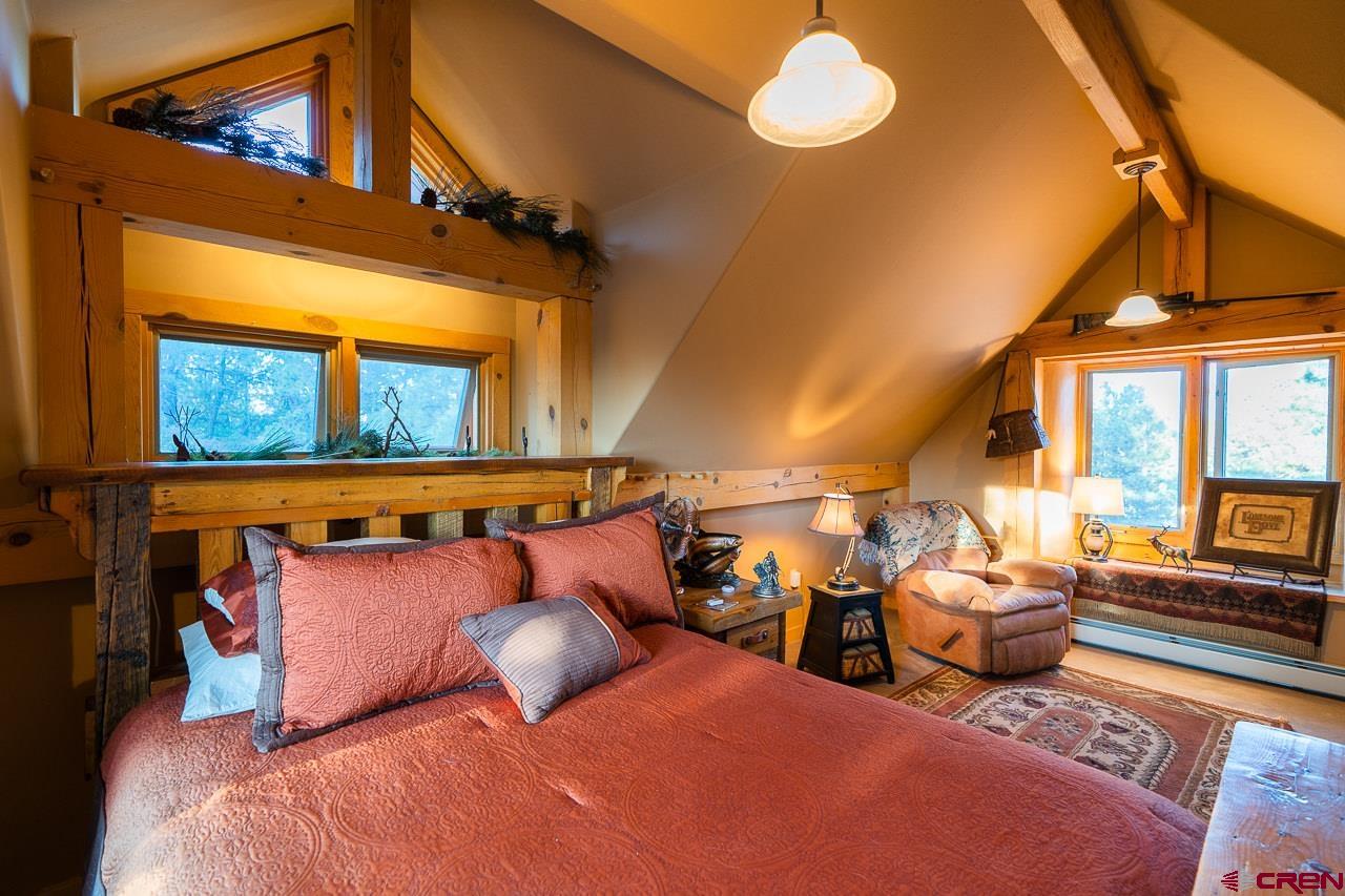 200 Longview Lane Bayfield, CO 81122 - Photo 20 of 33 a bedroom with furniture and a window