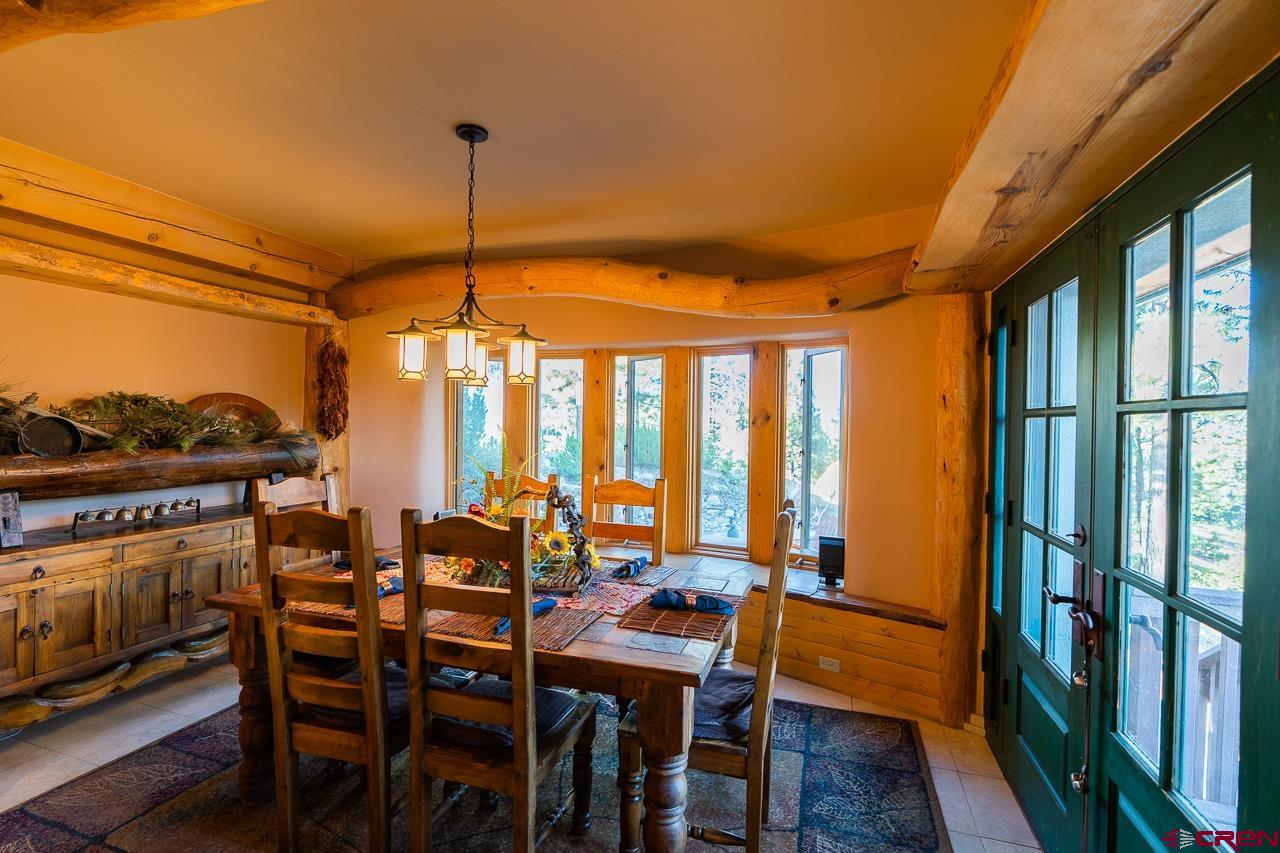 200 Longview Lane Bayfield, CO 81122 - Photo 2 of 33 a dining room with furniture window and wooden floor