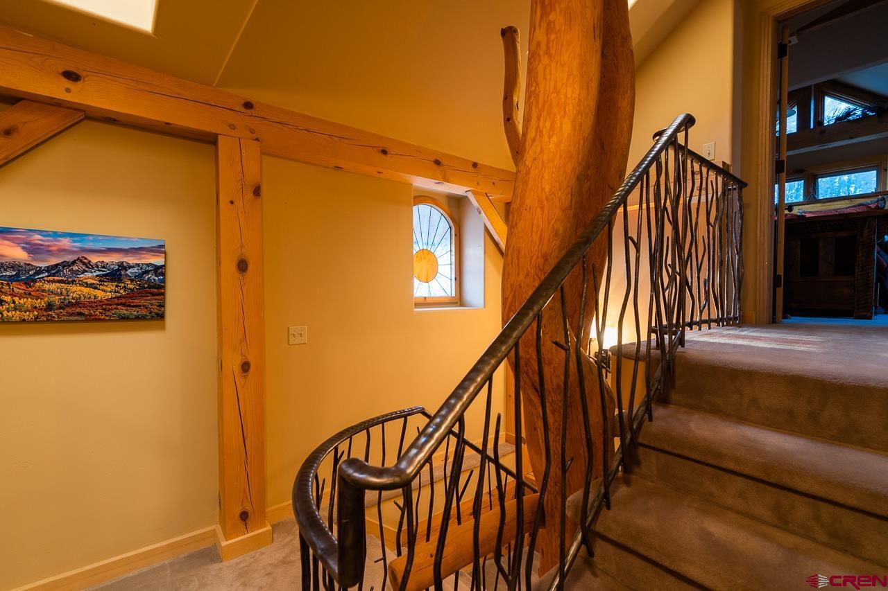 200 Longview Lane Bayfield, CO 81122 - Photo 22 of 33 a view of stairs and a hall with wooden floor