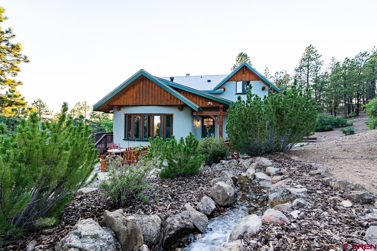 200 Longview Lane Bayfield, CO 81122 - Photo 26 of 33 a front view of a house with garden
