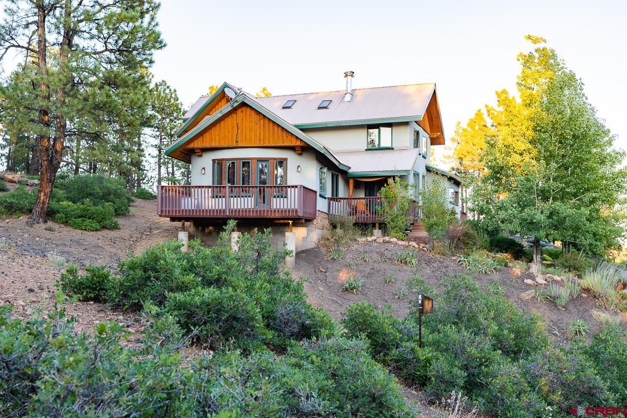 200 Longview Lane Bayfield, CO 81122 - Photo 27 of 33 a view of a house with a small yard and large tree