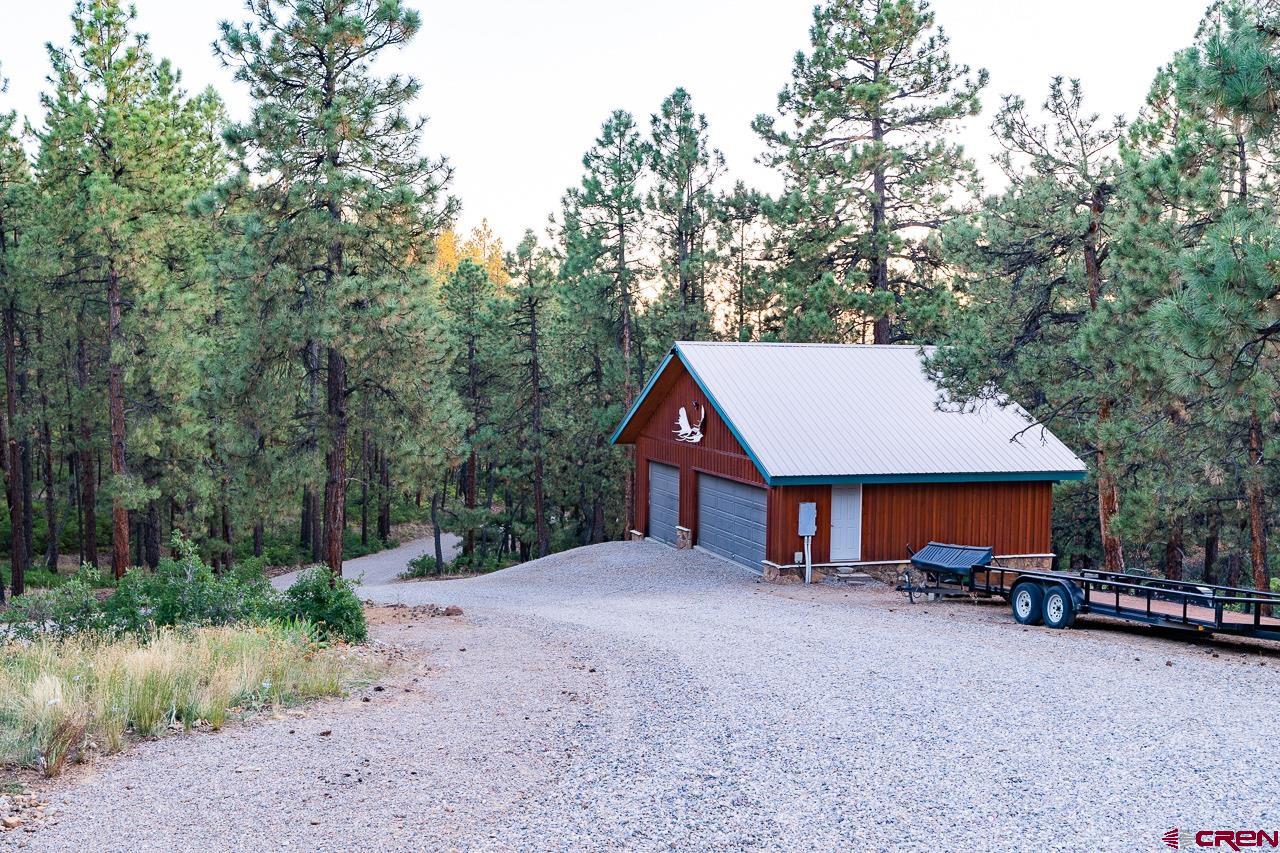200 Longview Lane Bayfield, CO 81122 - Photo 32 of 33 a view of a house with a backyard and tree