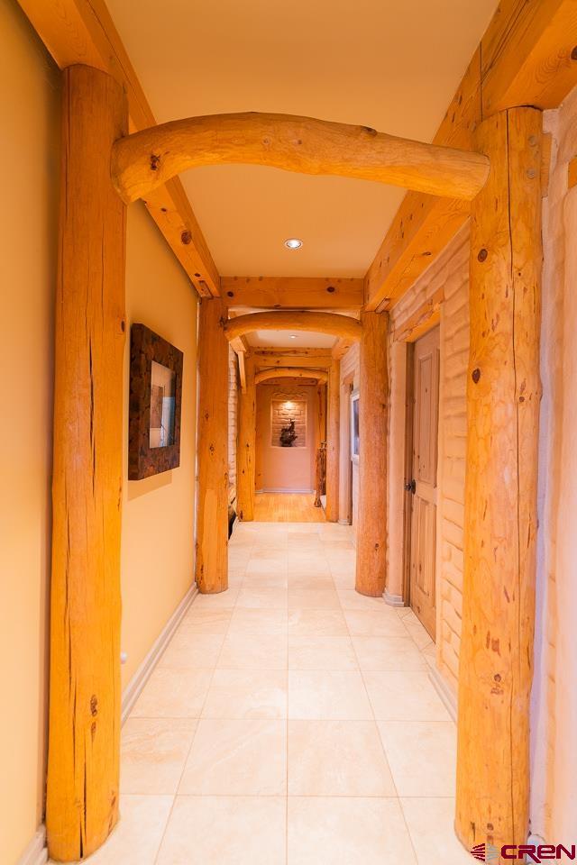 200 Longview Lane Bayfield, CO 81122 - Photo 4 of 33 a view of a hallway with wooden floor and a bathroom