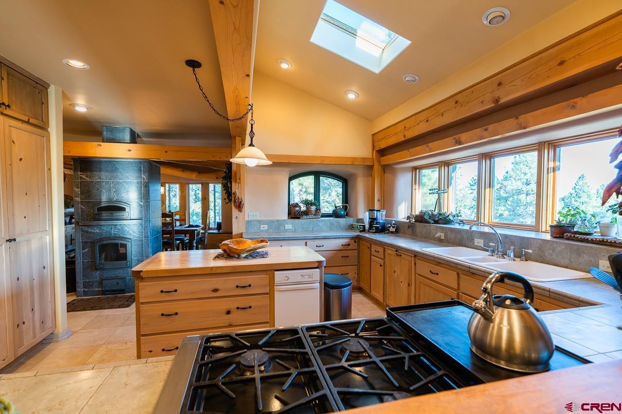 200 Longview Lane Bayfield, CO 81122 - Photo 6 of 33 a kitchen with stainless steel appliances kitchen island granite countertop a sink and cabinets