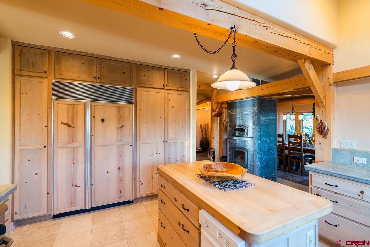 200 Longview Lane Bayfield, CO 81122 - Photo 8 of 33 a kitchen that has a kitchen island wooden cabinets and stainless steel appliances