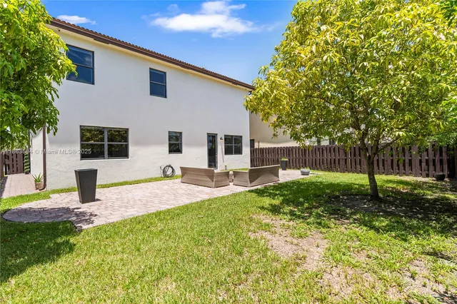 a bedroom with a bed and a lamp with window