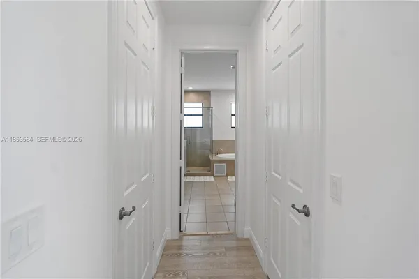 a bathroom with a sink double vanity and a mirror