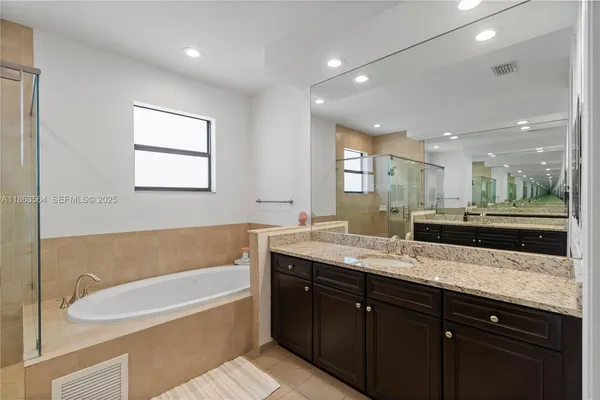 a bathroom with a shower and a window