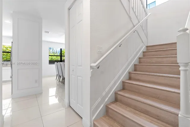 a view of entryway and hall with wooden floor