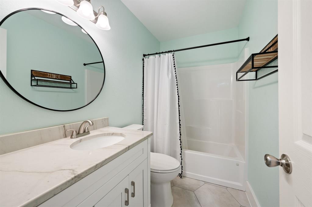 7384 Rector Road Sanger, TX 76266 - Photo 17 of 40 a bathroom with a sink and a mirror