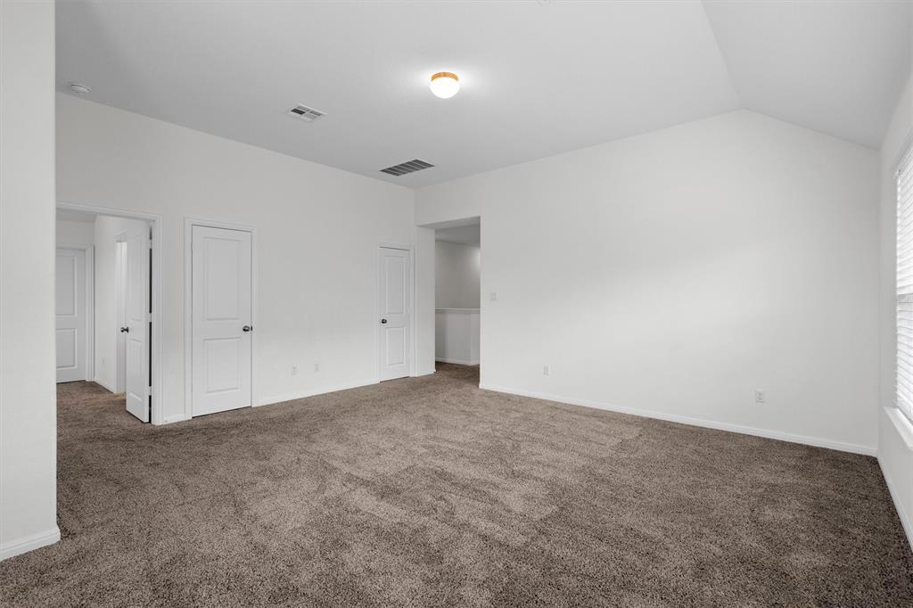 236 Prato Place Georgetown, TX 78628 - Photo 27 of 40 Plenty of floor space with neutral carpet for versatile design in this inviting room.