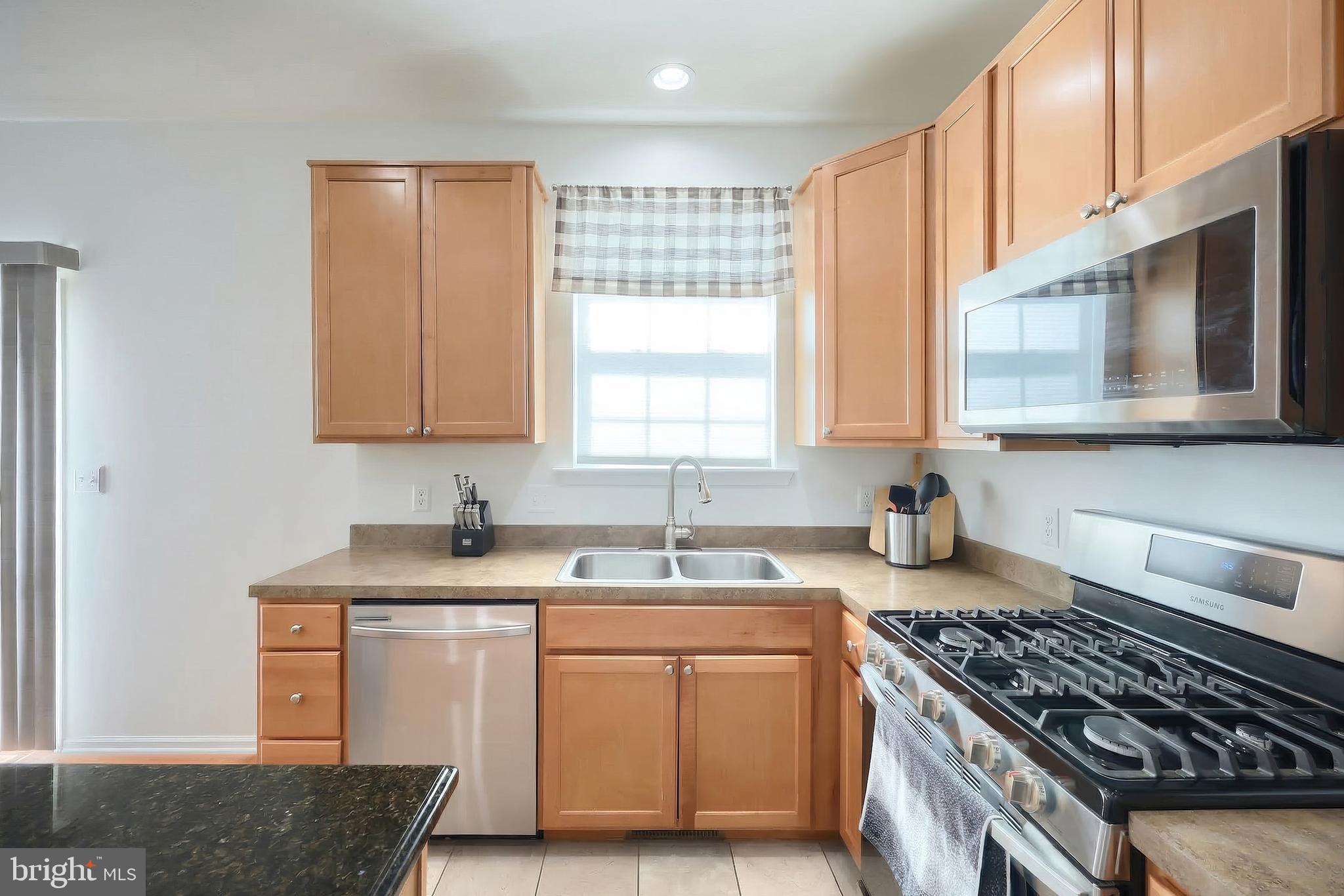 322 Cape Climb York, PA 17408 - Photo 21 of 31 a kitchen with sink a stove and cabinets
