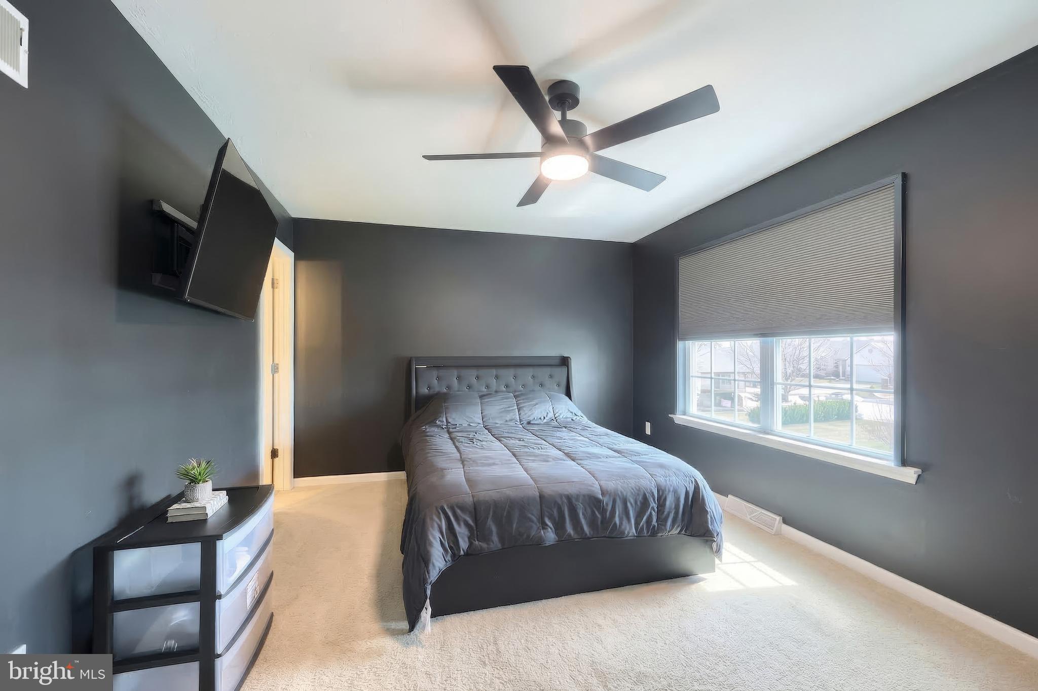 322 Cape Climb York, PA 17408 - Photo 28 of 31 a bedroom with a large bed and a tv