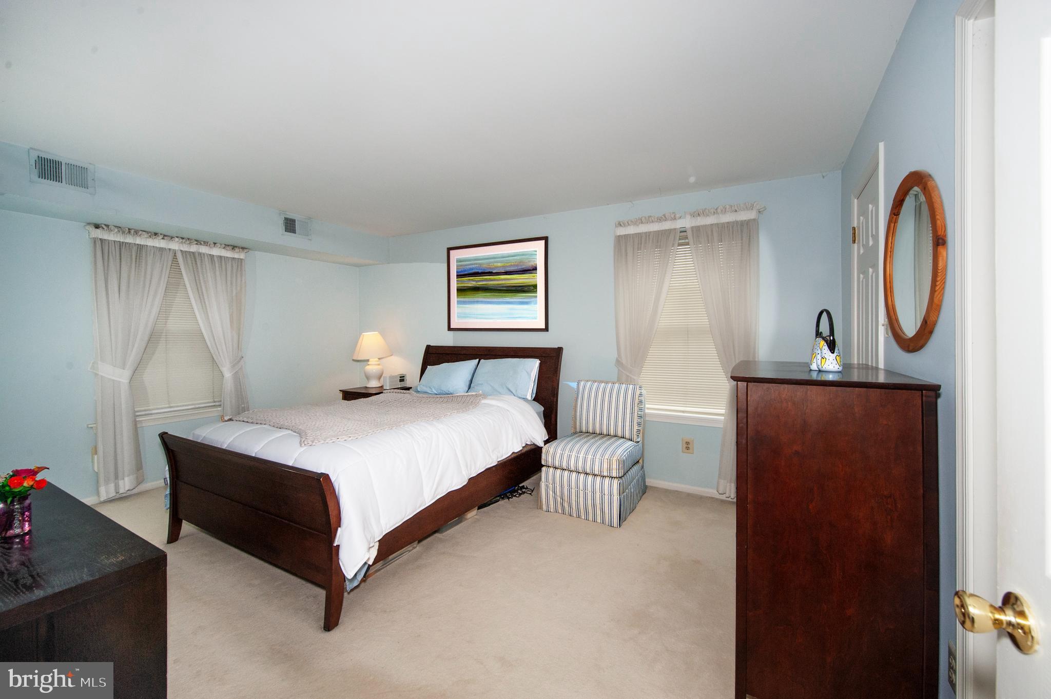 631 Washington Place Chesterbrook, PA 19087 - Photo 14 of 21 a bedroom with a bed and a chandelier