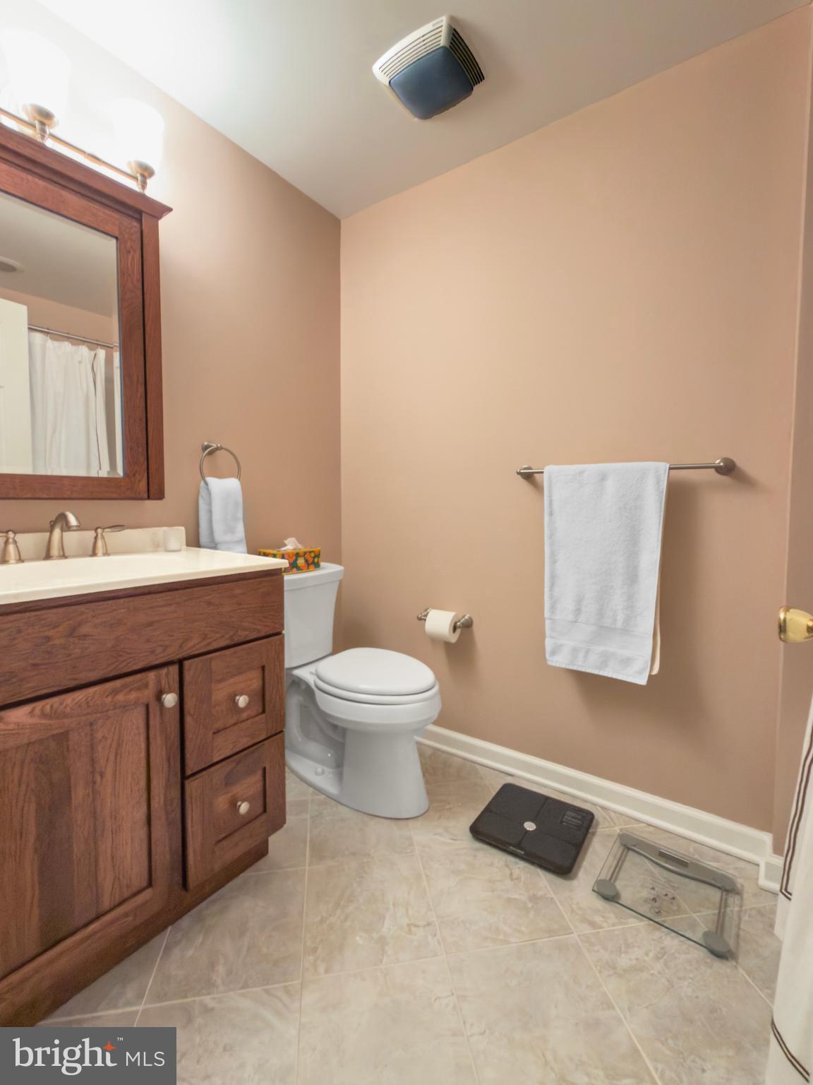 631 Washington Place Chesterbrook, PA 19087 - Photo 19 of 21 a bathroom with a toilet sink and mirror