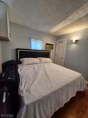 a bed sitting in a bedroom and dressers