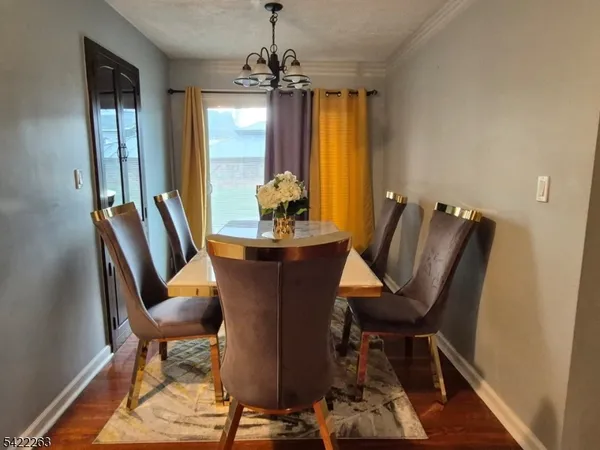 a view of a dining room with furniture and window