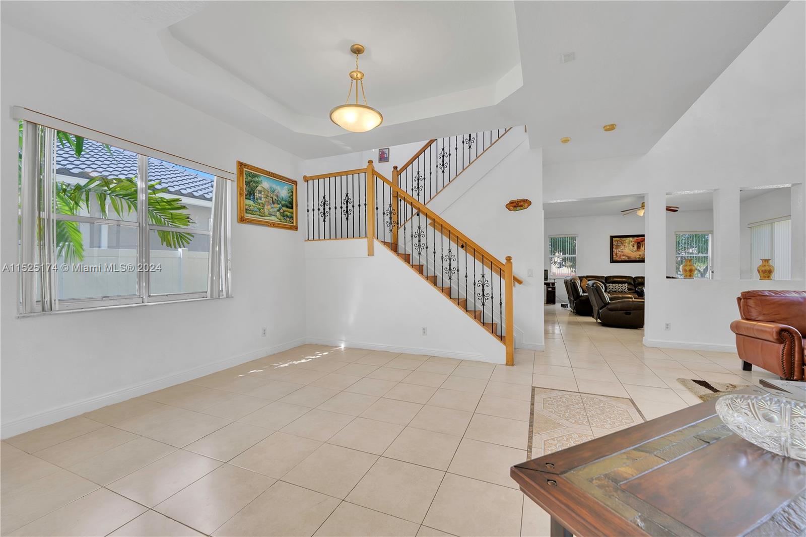 14093 Southwest 53rd Street Miramar, FL 33027 - Photo 13 of 45 a view of entryway and hall with wooden floor