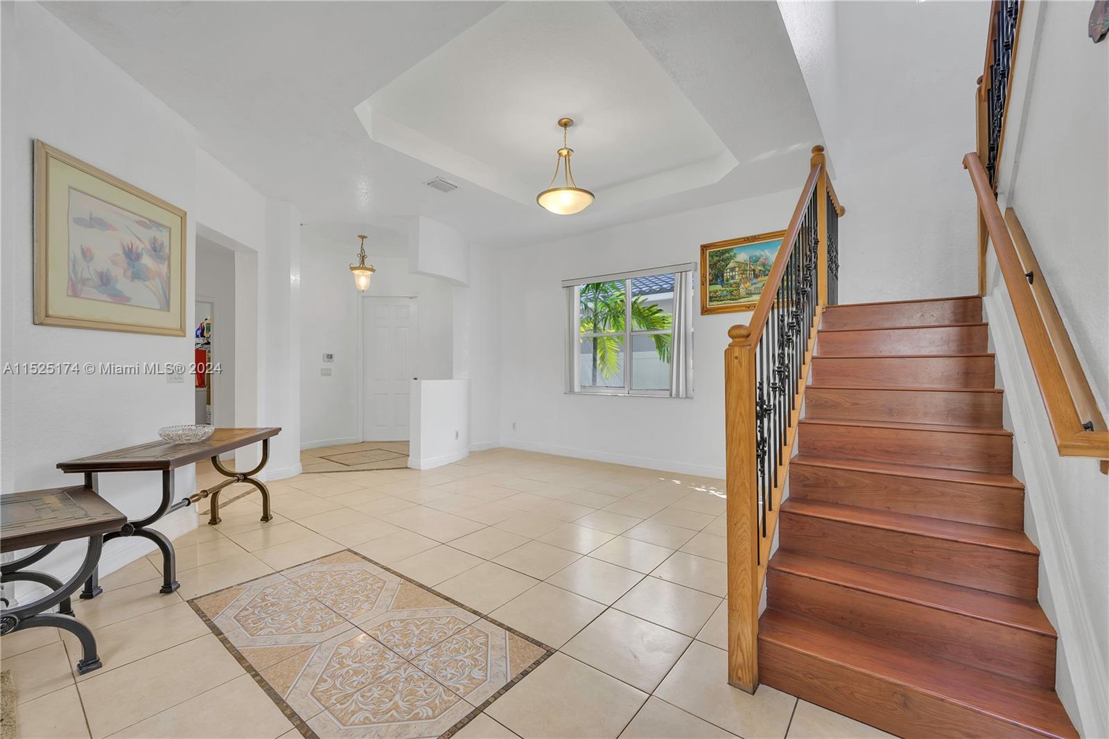 14093 Southwest 53rd Street Miramar, FL 33027 - Photo 14 of 45 a view of an entryway with wooden floor and windows