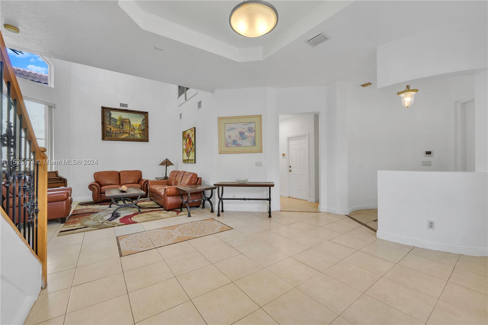 14093 Southwest 53rd Street Miramar, FL 33027 - Photo 15 of 45 a living room with furniture and a table