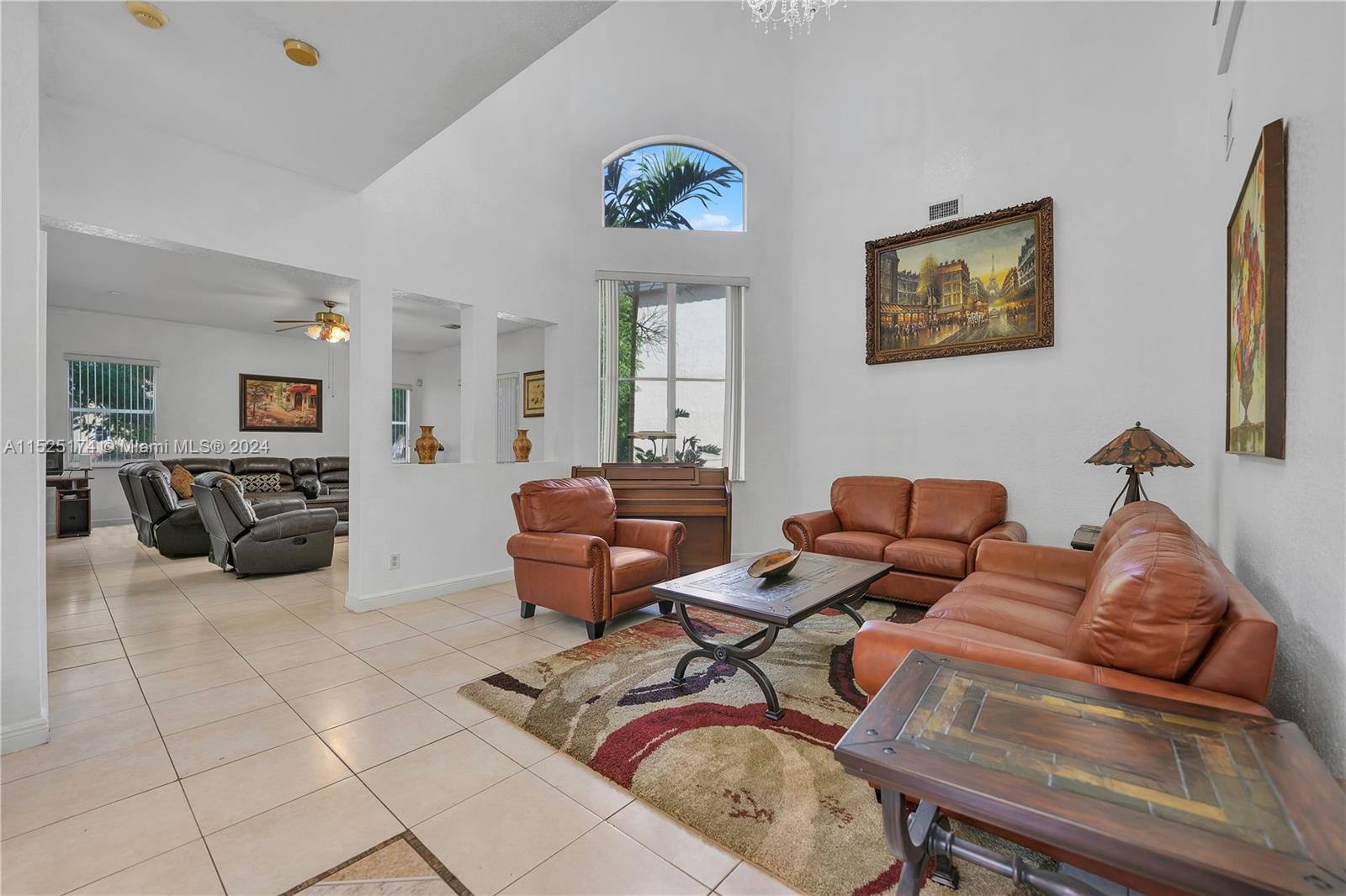 14093 Southwest 53rd Street Miramar, FL 33027 - Photo 16 of 45 a living room with furniture a couch and two windows