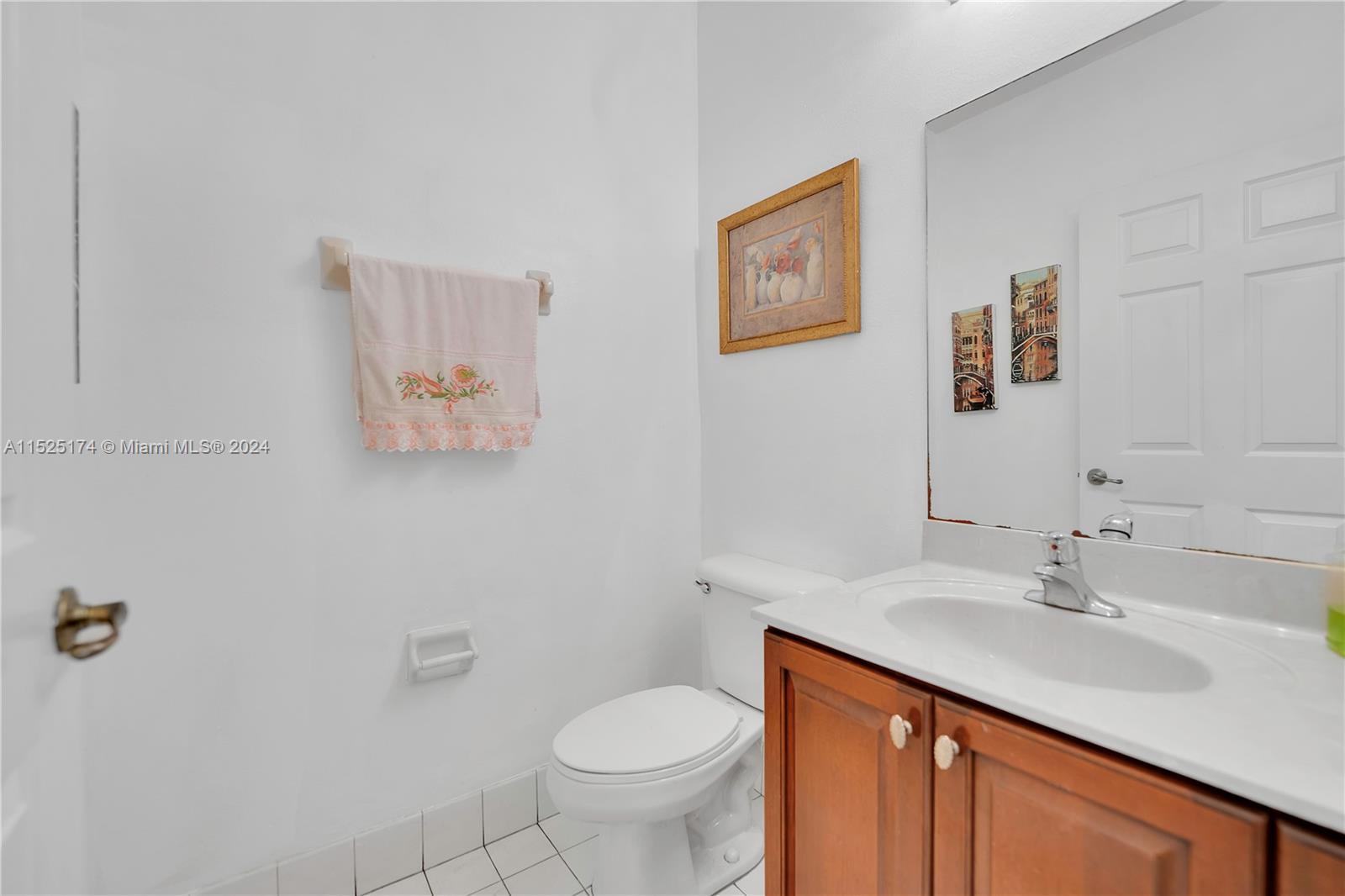 14093 Southwest 53rd Street Miramar, FL 33027 - Photo 26 of 45 a bathroom with a sink toilet and vanity