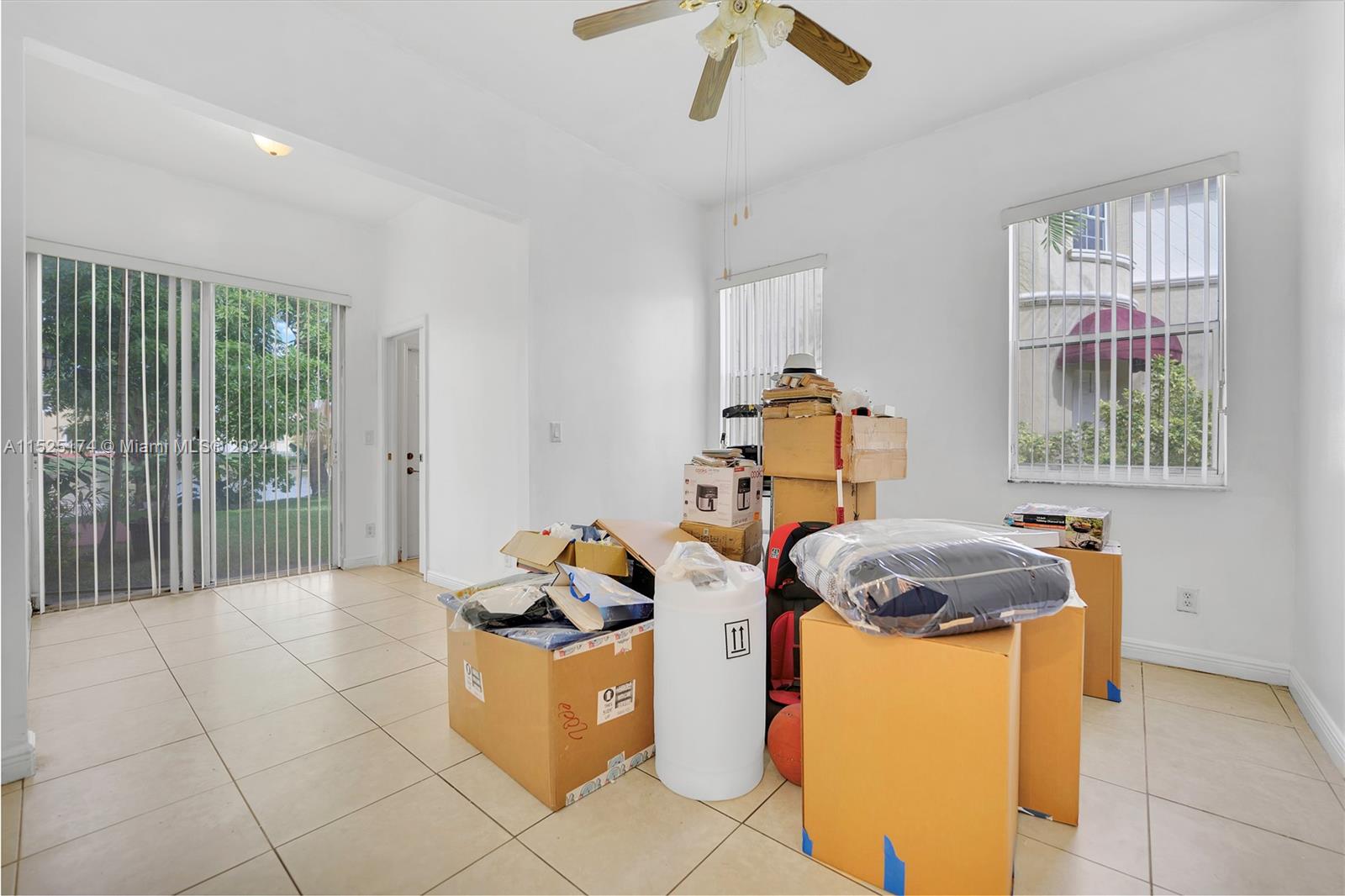 14093 Southwest 53rd Street Miramar, FL 33027 - Photo 27 of 45 a bedroom with a bed and a dresser