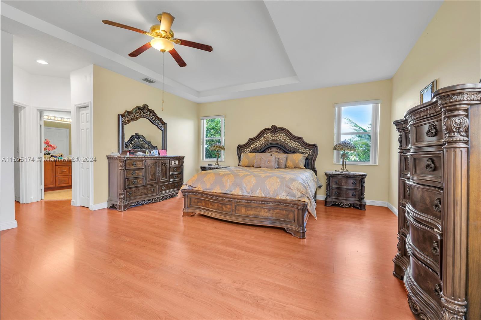 14093 Southwest 53rd Street Miramar, FL 33027 - Photo 30 of 45 a bedroom with a bed closet and a flat tv screen