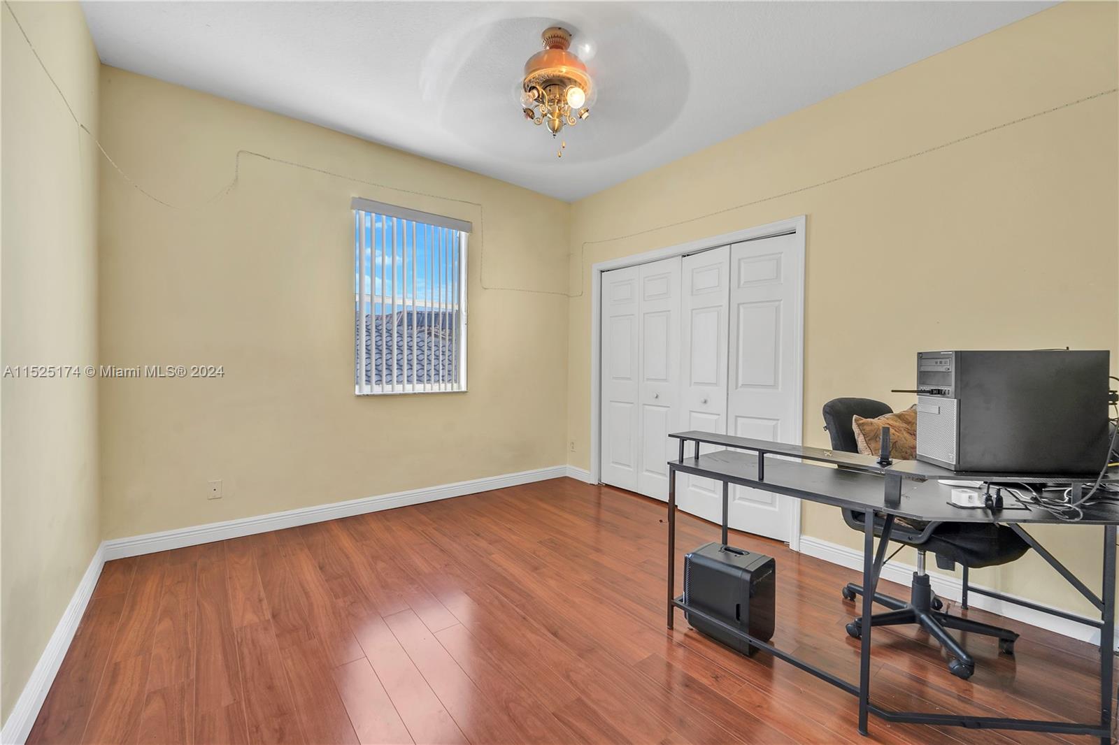 14093 Southwest 53rd Street Miramar, FL 33027 - Photo 34 of 45 a workspace with furniture and wooden floor