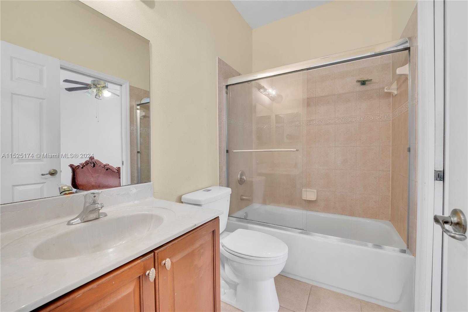 14093 Southwest 53rd Street Miramar, FL 33027 - Photo 36 of 45 a bathroom with a sink and a mirror