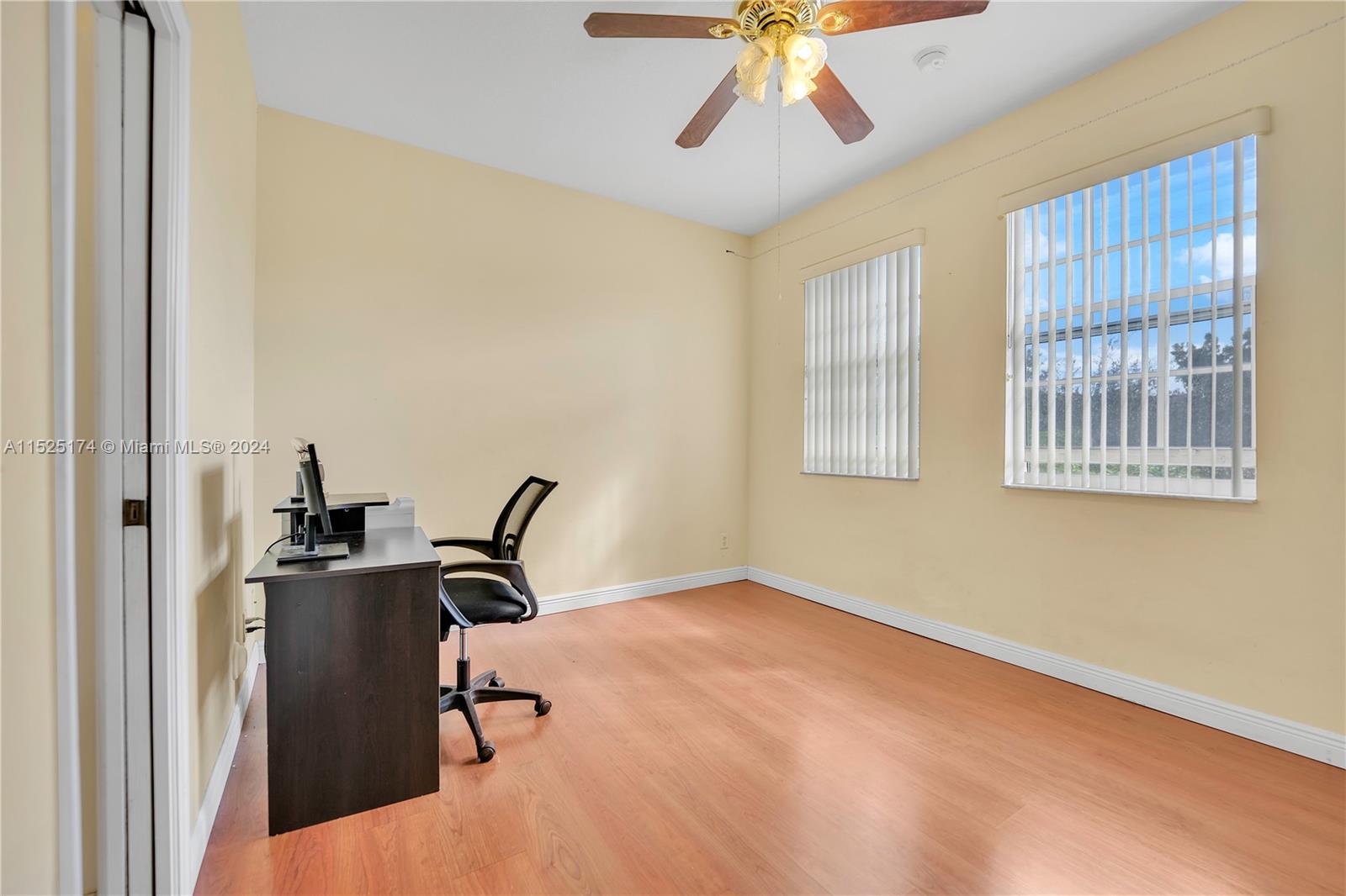 14093 Southwest 53rd Street Miramar, FL 33027 - Photo 38 of 45 a view of a workspace with furniture and a window