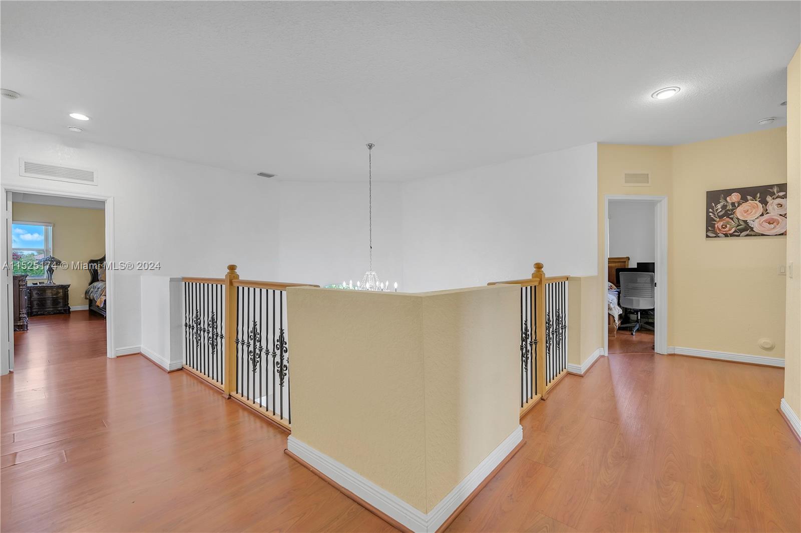 14093 Southwest 53rd Street Miramar, FL 33027 - Photo 41 of 45 a view of a hallway with wooden floor