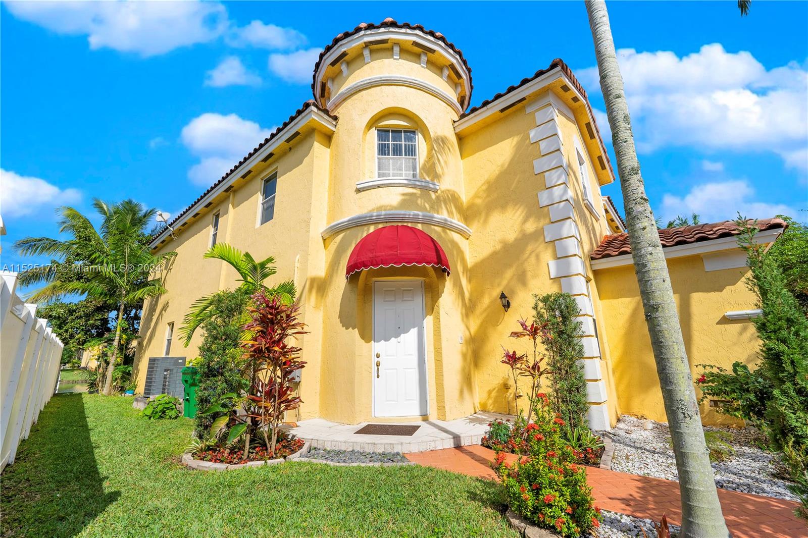 14093 Southwest 53rd Street Miramar, FL 33027 - Photo 43 of 45 a view of a multi story residential apartment building with a yard