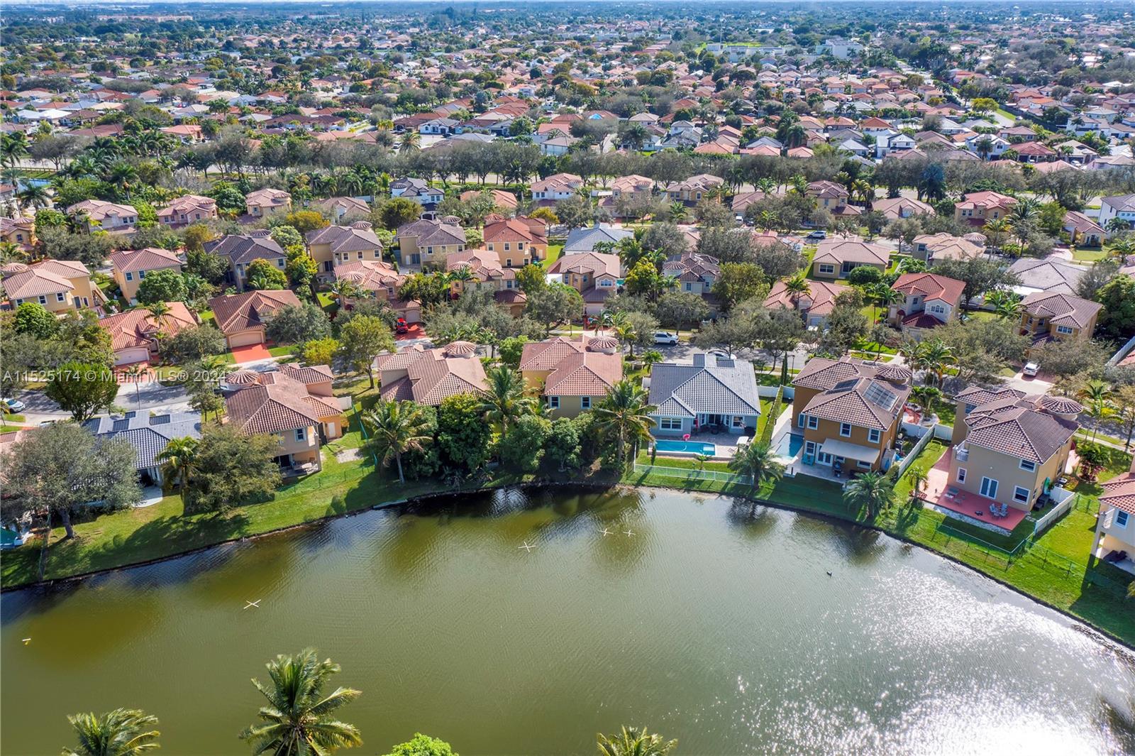 14093 Southwest 53rd Street Miramar, FL 33027 - Photo 7 of 45 an aerial view of residential houses with outdoor space and lake view