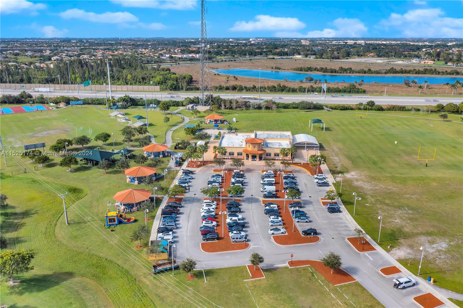 14093 Southwest 53rd Street Miramar, FL 33027 - Photo 10 of 45 swimming pool view with a lake view