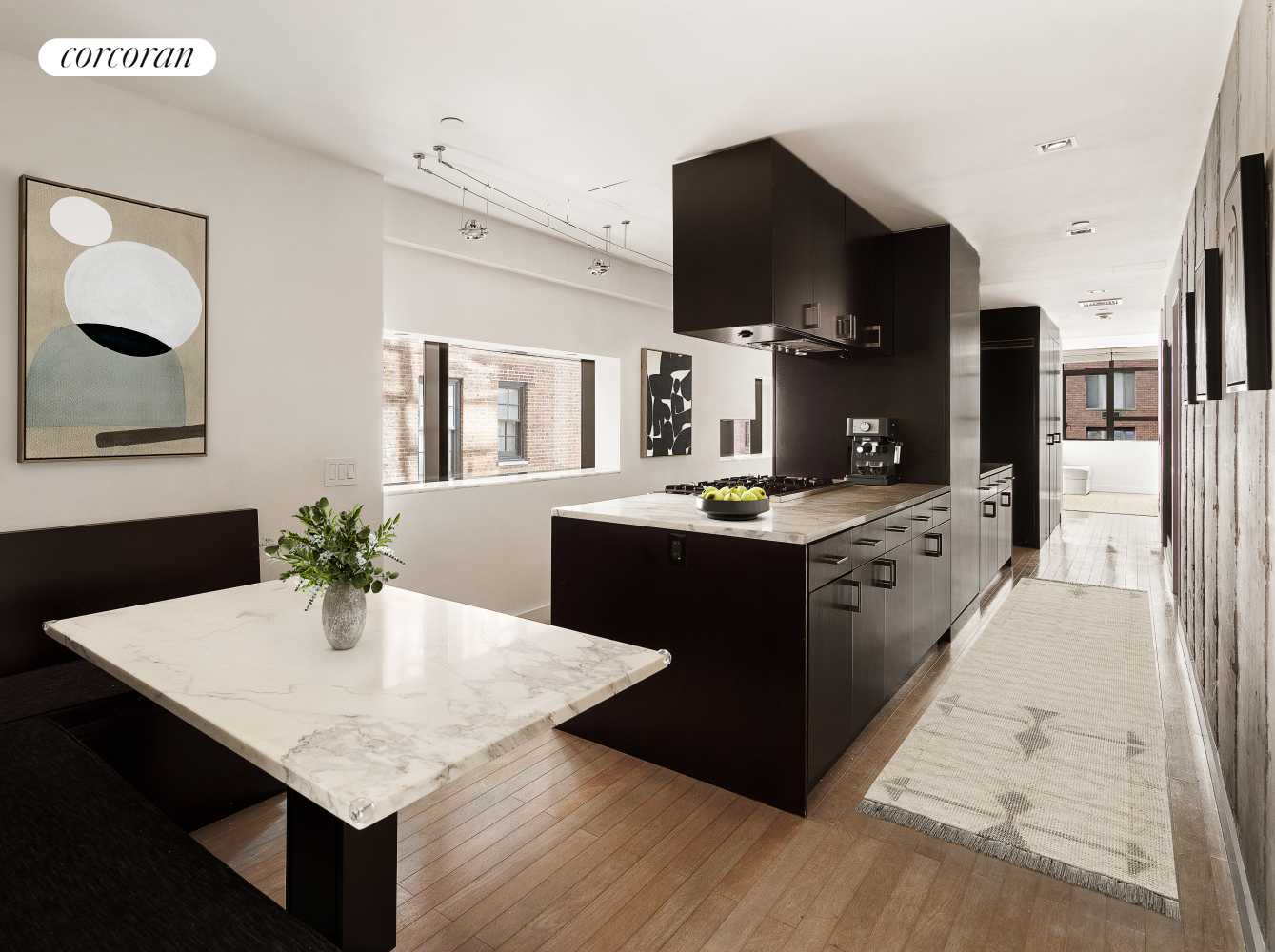 441 East 57th Street, Unit 8/9 Manhattan, NY 10022 - Photo 1 of 7 a kitchen with a sink a counter top space and stainless steel appliances