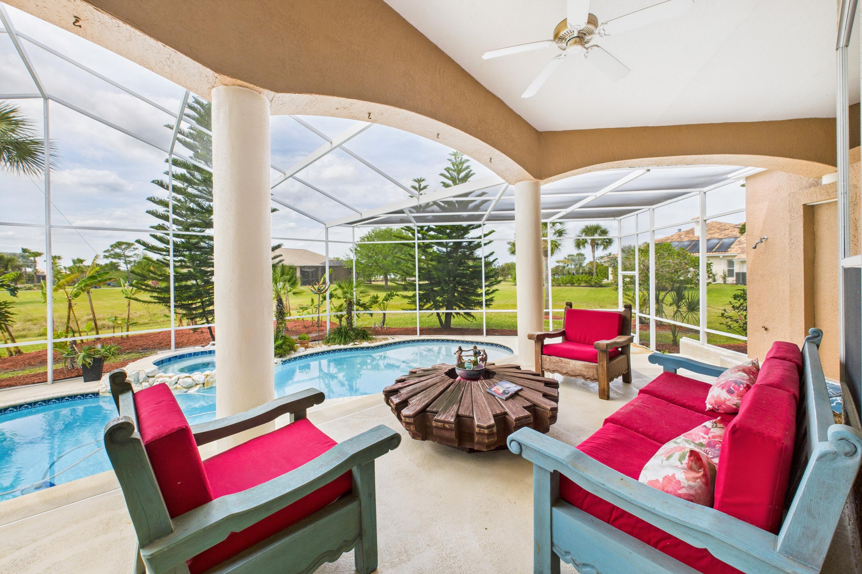 909 Preakness Place Rockledge, FL 32955 - Photo 12 of 24 a view of a dining room with furniture large windows and wooden floor