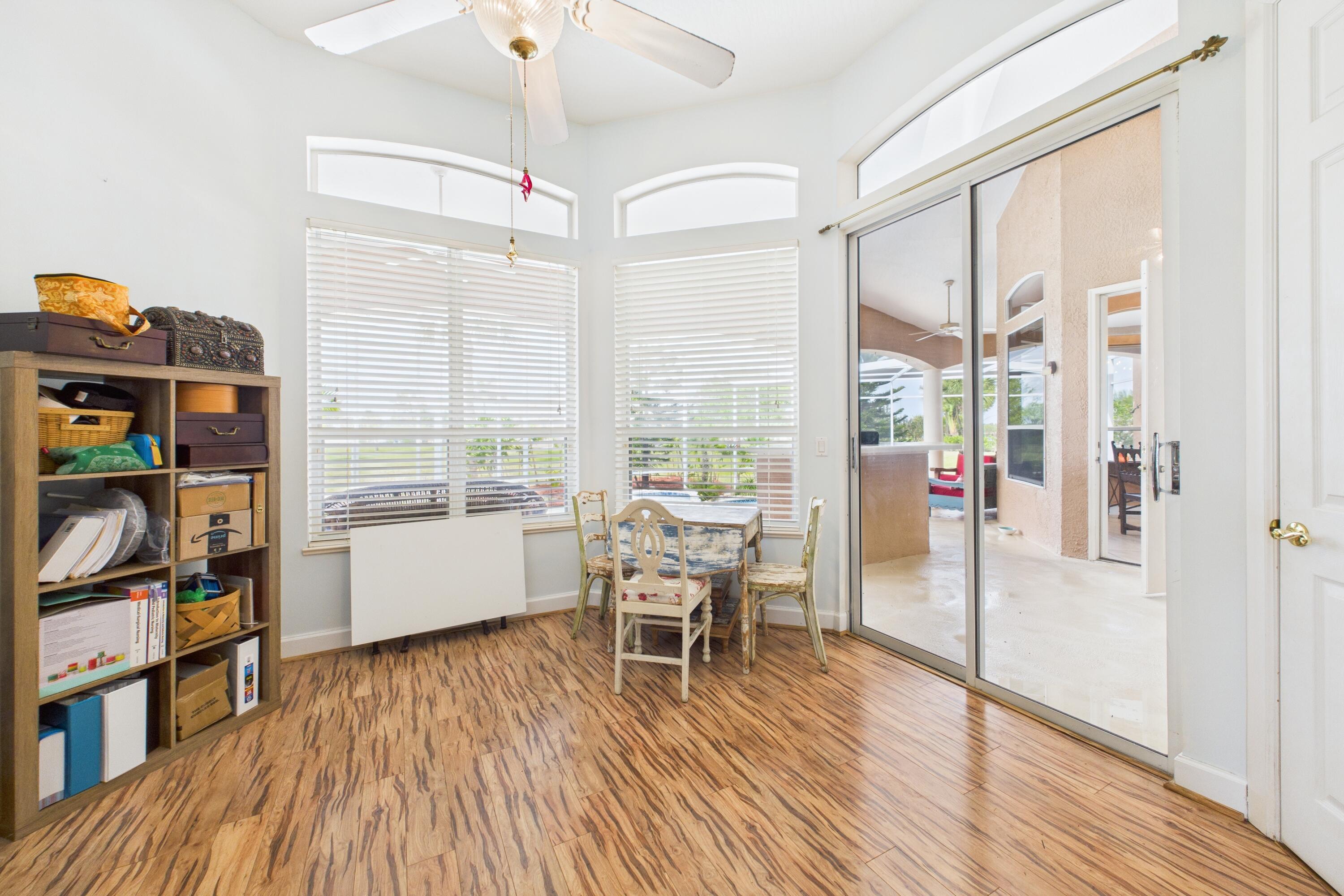 909 Preakness Place Rockledge, FL 32955 - Photo 20 of 24 a work room with furniture and a book shelf