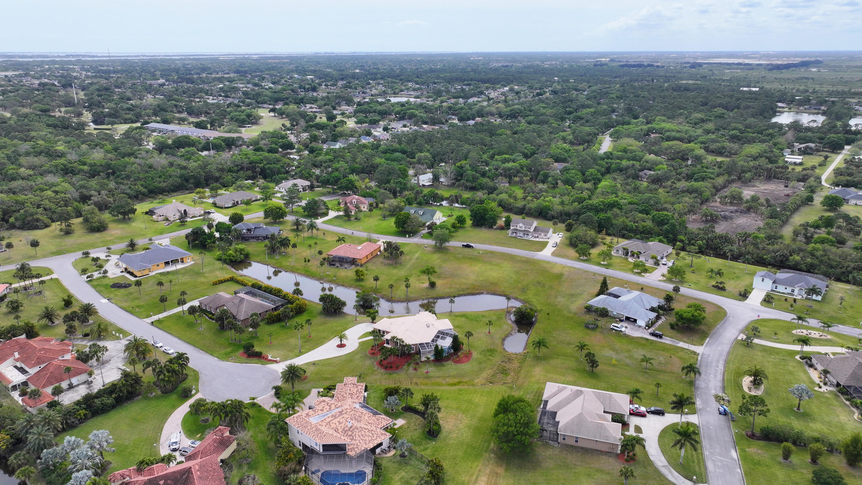 909 Preakness Place Rockledge, FL 32955 - Photo 22 of 24 an aerial view of residential houses with outdoor space