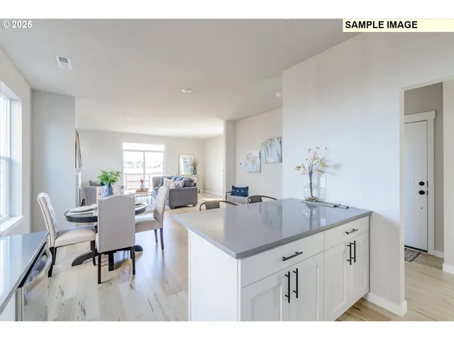 a view living room with granite countertop furniture and wooden floor