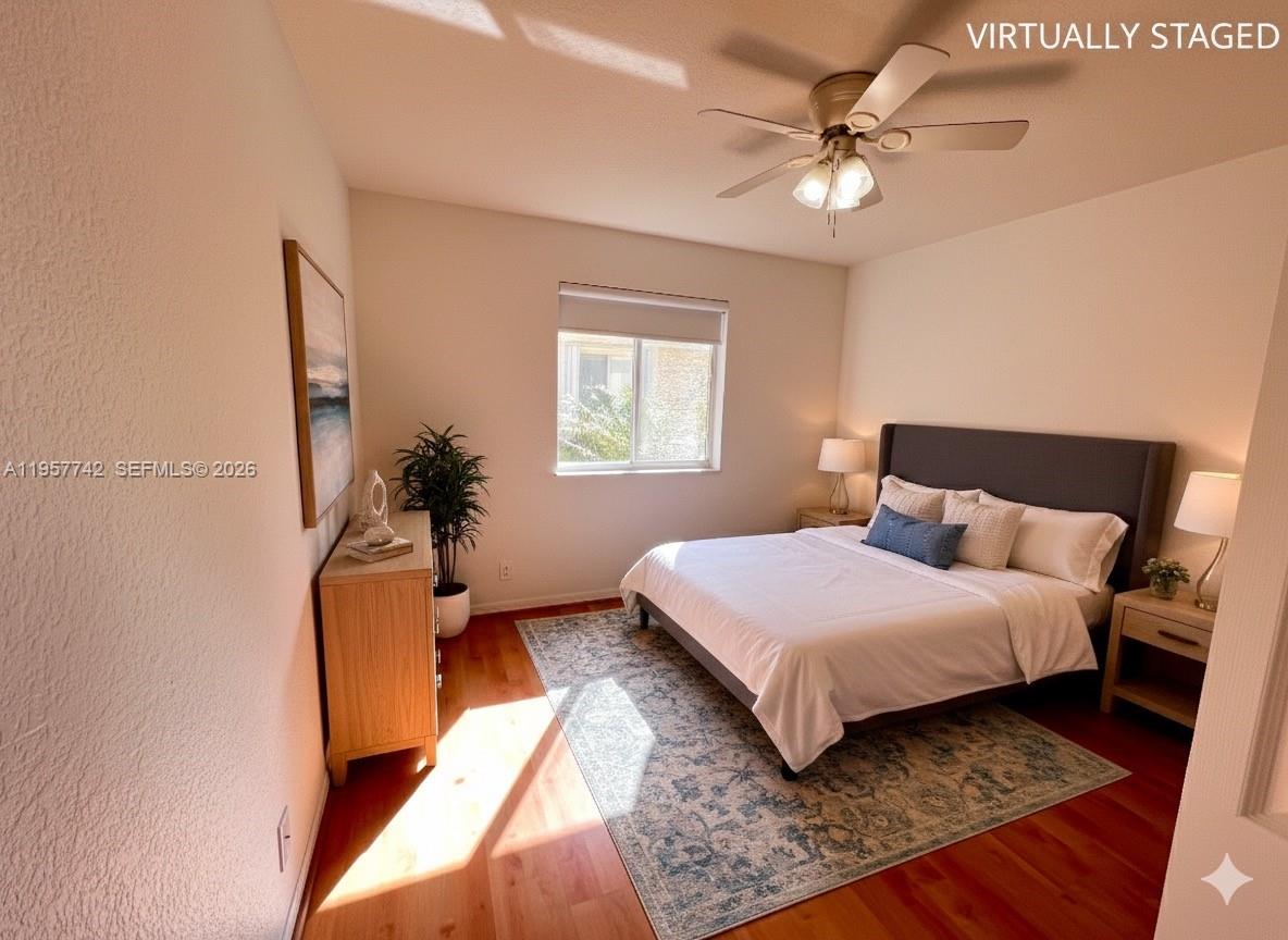 2433 Pasadena Way Weston, FL 33327 - Photo 14 of 20 a bedroom with a beds chandelier and a window