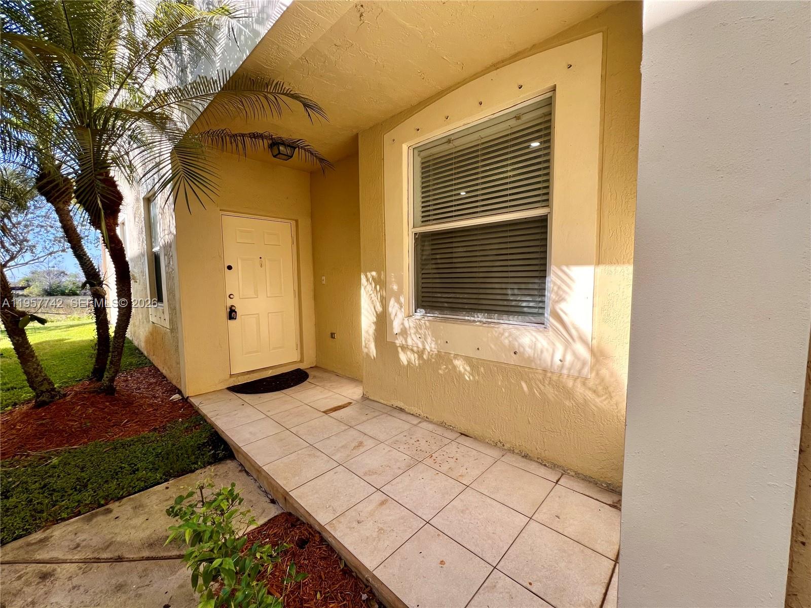 2433 Pasadena Way Weston, FL 33327 - Photo 19 of 20 a view of a backyard of the house