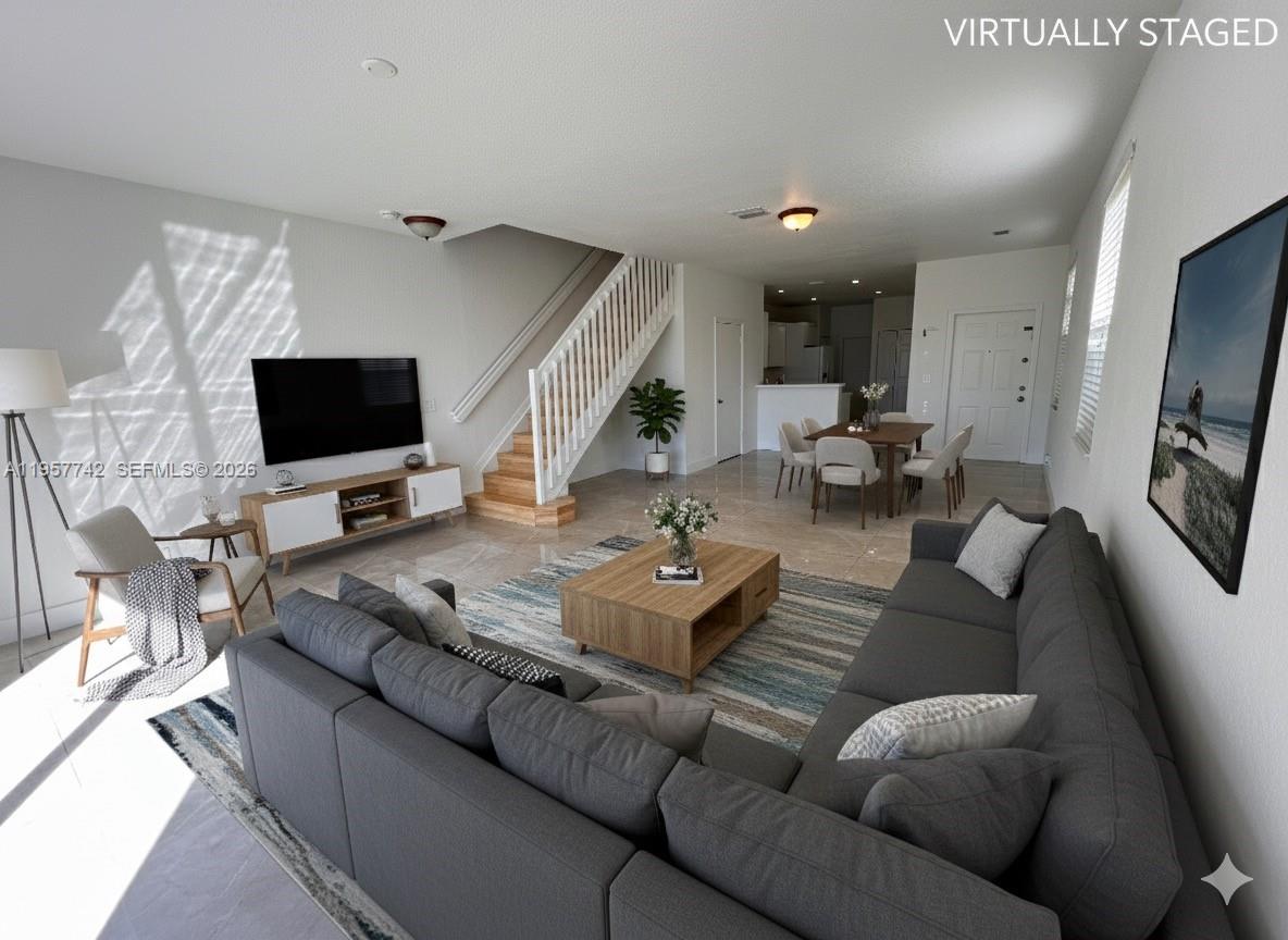 2433 Pasadena Way Weston, FL 33327 - Photo 4 of 20 a living room with furniture and a flat screen tv