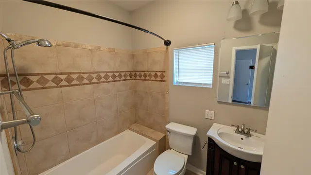 a view of a bench in backyard of house