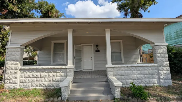 a bathroom with a glass shower door and mirror