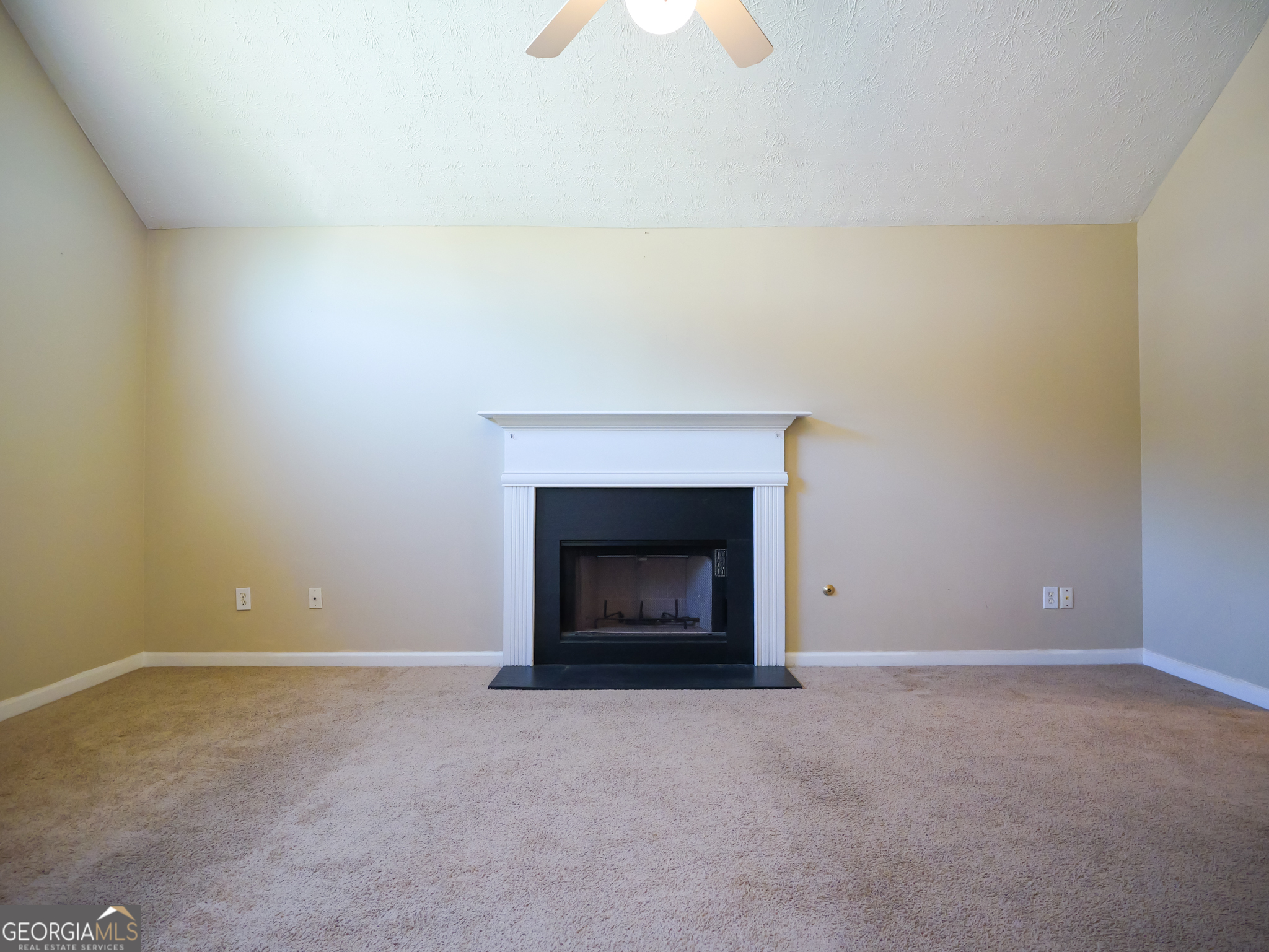 11036 Pebble Ridge Drive Hampton, GA 30228 - Photo 25 of 35 a view of an empty room with a fireplace
