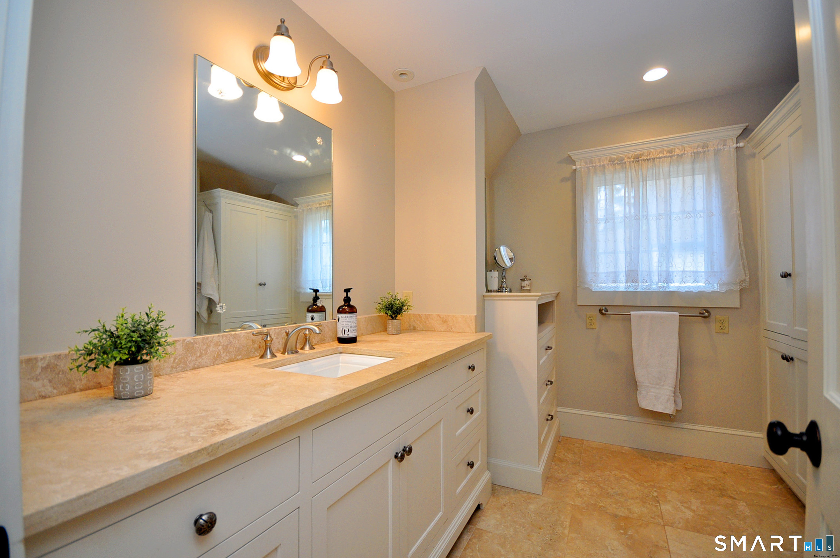 371 North Main Street Suffield, CT 06078 - Photo 21 of 39 a bathroom with a sink a vanity and a mirror