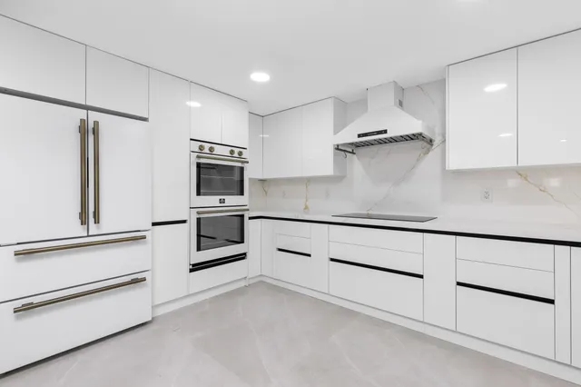 a living room with furniture and a ceiling fan