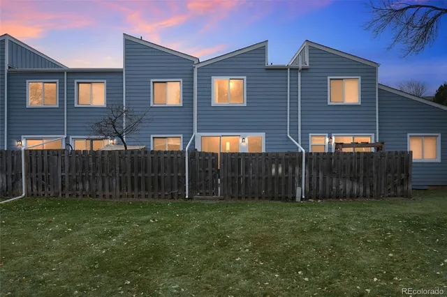 a front view of house yard and a fence