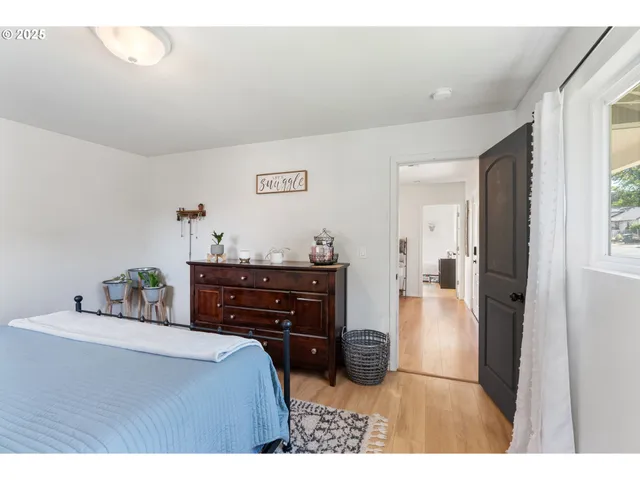 a bed room with a bed and a dresser